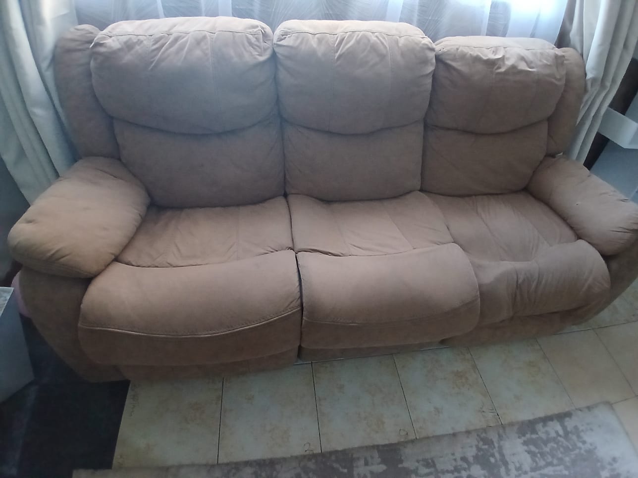 Damaged recliner before repair