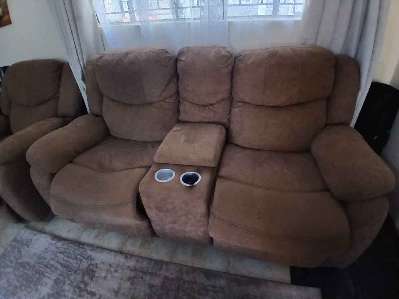 Damaged recliner before repair